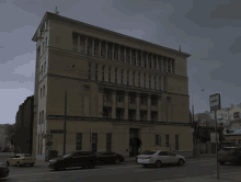 a large building with a blue sign that says " bus " on it