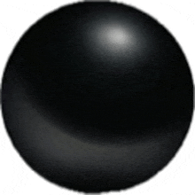 a close up of a black ball on a white background