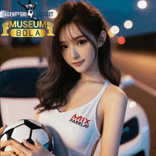 a woman is holding a soccer ball in front of a museum bola sign