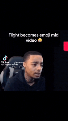 a cartoon character is sitting in a chair with a smiley face on his face and the words `` flight becomes emoji mid video ''