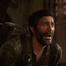 a man with a beard and a backpack is crying in a video game