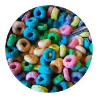 a pile of colorful cereal rings in a circle on a white background