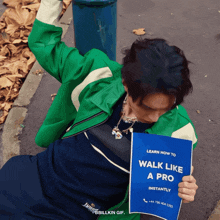 a man in a green jacket is holding a blue sign that says learn how to walk like a pro instantly