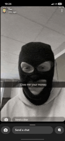 a man wearing a ski mask says give me your money on a phone screen