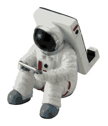 a figurine of an astronaut is sitting on a phone holder