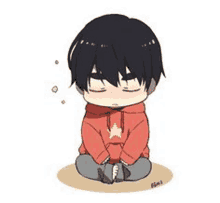 a boy in a red hoodie is sitting on the ground with his eyes closed and a star on his chest .