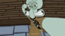 squidward from spongebob squarepants is standing in front of a brick wall wearing a suit and tie .