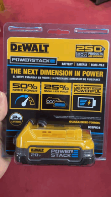 a person is holding a dewalt power stack 20v battery