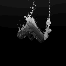 a black and white drawing of a gun being sprayed with water