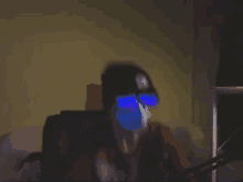 a blurry picture of a person wearing glasses and a mask