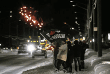 a group of people holding a flag that says " frideau "