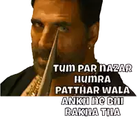 a man with a knife in his eye and the words tum par nazar humra patthar wala