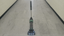 a shark vacuum cleaner is sitting on a tiled floor