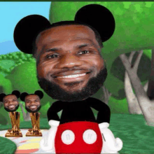 a cartoon of lebron james wearing mickey mouse ears and holding a mickey mouse head .