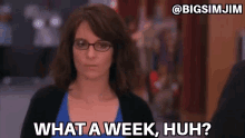 a woman wearing glasses says what a week huh on a screen