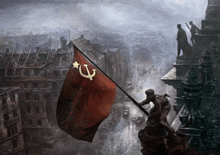 a statue of a man holding a red flag with a hammer and sickle