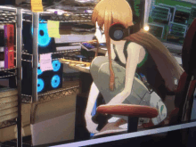 a girl wearing headphones sits at a desk in front of a computer monitor