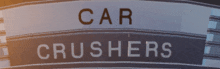 a sign that says car crushers on it in white letters