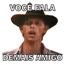 a man wearing a cowboy hat with the words `` você fala demais amigo '' on it .