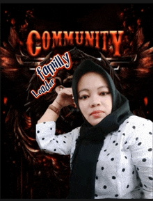 a woman stands in front of a poster that says community