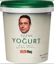 a tub of yogurt with a man 's face on it .