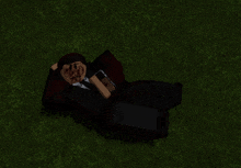 a man in a suit and tie is laying on the grass with blood on his face