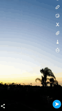 a screen shot of a sunset with icons on it