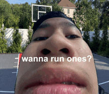 a close up of a man 's face with the words " wanna run ones " above his mouth