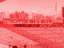 a stadium with a sign that says tetracampeonato hay 1 solo