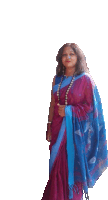 a woman in a purple and blue saree with a blue shawl