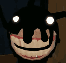 a close up of a cartoon character with glowing eyes and a smiling face .