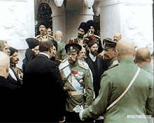 a group of men in military uniforms are gathered in front of a building with the words royalty in colour written on the bottom