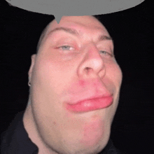 a man making a funny face with a speech bubble above his head