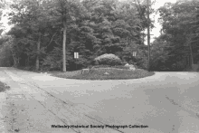 a black and white photo of an intersection taken by the wellesley historical society