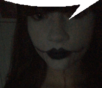 a close up of a woman 's face with black lips