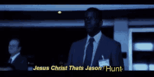 a man in a suit and tie is saying jesus christ thats jason hunt .