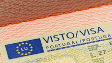 a passport opened to a page that says visto / visa portugal / portugal