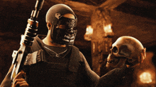 a man wearing a mask is holding a skull and a gun