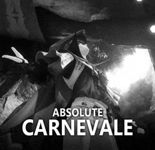 a black and white photo of a person with the words absolute carnevale