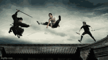 a group of people flying through the air with swords