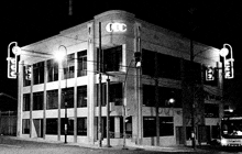 a black and white photo of a building that says tcc on the side