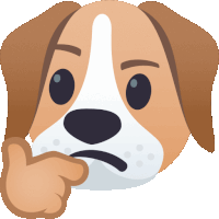 a brown and white dog with a hand on its face