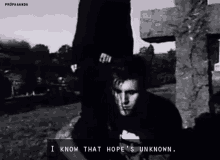 a black and white photo of a man with the words i know that hope 's unknown