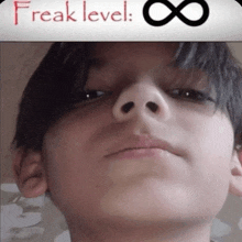 a picture of a young boy with the words freak level written above him