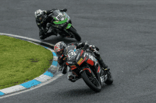 a motorcycle racer with the number 30 on the front of his motorcycle