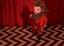 a man with a beard is standing in front of a red curtain on a chevron floor