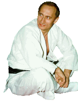 a man in a white karate uniform is sitting on the ground