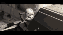 a clone trooper is sitting on top of a vehicle in a video game .