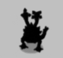 a silhouette of a monster with two arms and two legs on a white background .