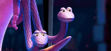 a cartoon snake with two heads is hanging from a string .